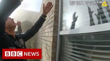 Toddler tossed to safety from burning building - BBC News