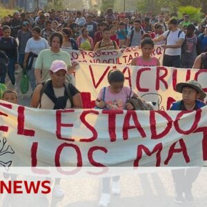 Migrants march through Mexico demanding justice over detention centre deaths - BBC News