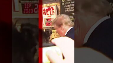 Donald Trump signed a woman's top and gave out pizza as he visited a pub. #Shorts #Iowa #DonaldTrump