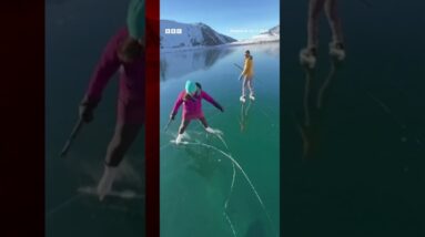 An ice rescue instructor and his wife skated on a rare 'ice-window' in Alaska. #IceSkating #BBCNews