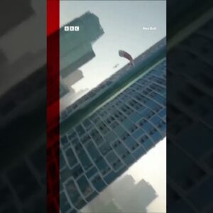 Brian Grubb combines drone wakeskating and base jumping. #Shorts #Wakeskate #Dubai #BBCNews