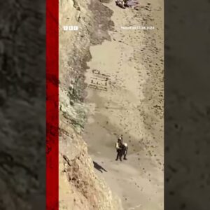 A kite surfer was airlifted to safety after writing 'HELP' in the sand. #Kitesurfing #BBCNews