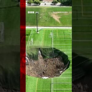 Watch moment sinkhole swallows football pitch leaving a 100 feet wide (30.5m) hole. #BBCNews