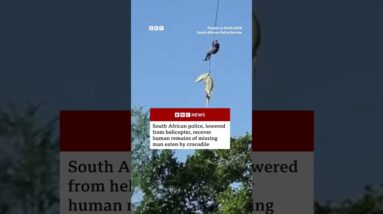 Police officer lowered into crocodile-infested river to recover human remains. #SouthAfrica #BBCNews