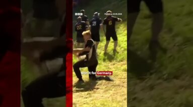 German YouTuber Tom Kopke wins first men's annual cheese-rolling race. #CoopersHill #BBCNews