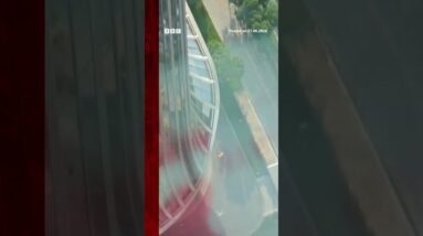 Debris falls after plane hits Beijing's tallest building. #BBCNews