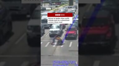 Driver in Spider-Man outfit helps man in wheelchair across busy road. #BBCNews #US