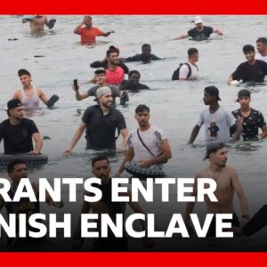 Thousands of migrants try to enter Spanish enclave of Ceuta from Morocco | BBC News