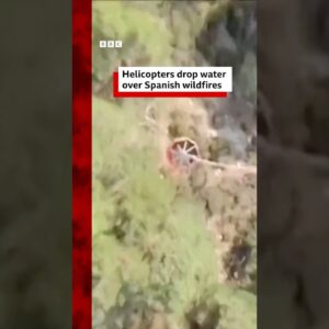 Helicopters drop water over Spanish wildfires. #BBCNews