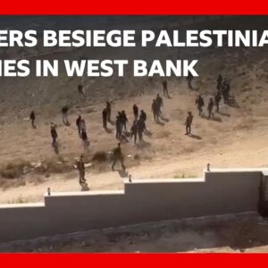 Israeli settlers trap two Palestinian families in West Bank | BBC News