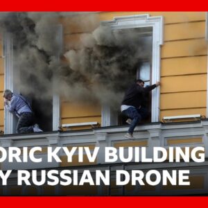 People flee burning building in Ukraine after Russian drone strike | BBC News