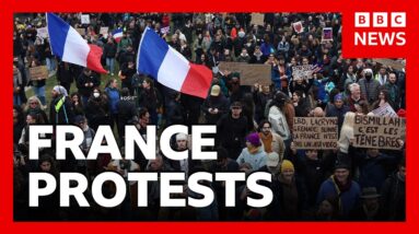French police arrest 135 people, as tens of thousands protest across country | BBC News