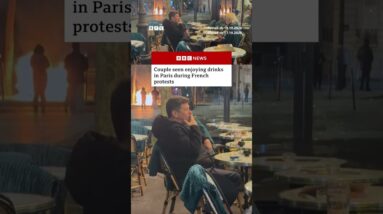 Couple seen enjoying drinks in Paris during French protests. #Paris #France #BBCNews