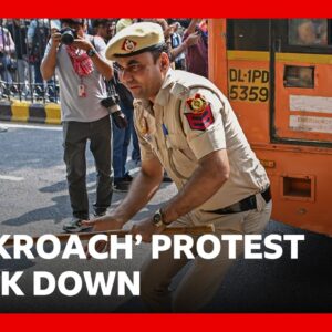 Police crack down on India 'cockroach' protest in Delhi | BBC News